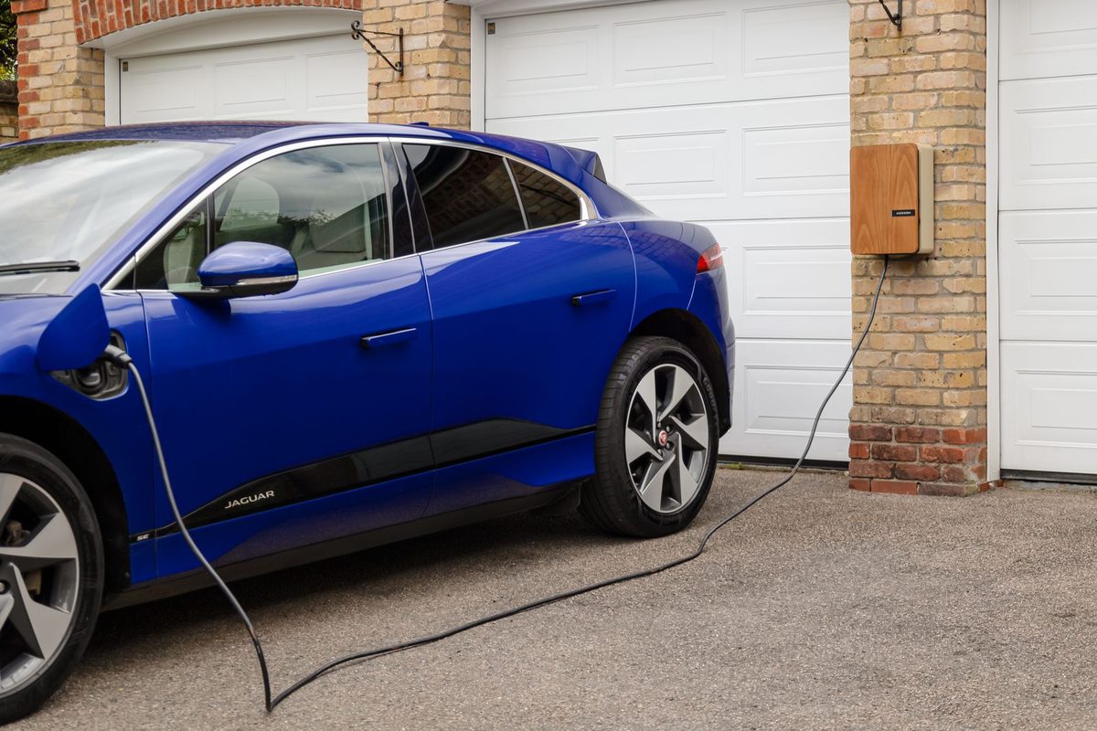 Electric car charging on a home driveway