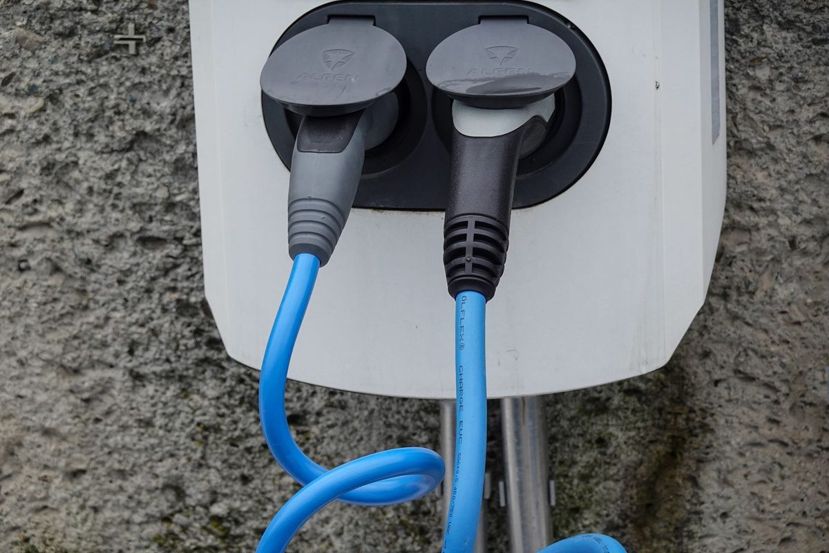 EV charging cable plugged into an electric car